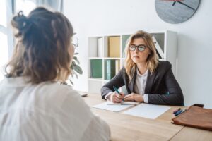 young female candidate interviewed by employer